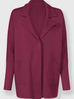 Veste en tricot douce avec col à revers et poches