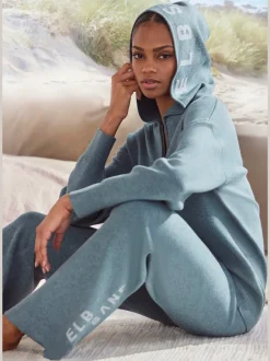 Veste en tricot douce à glissière et manches longues avec capuche