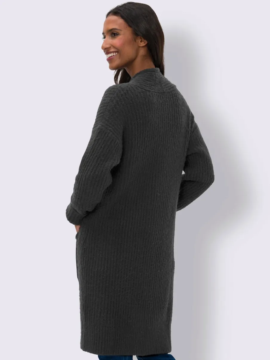 Veste en tricot doux à grosses mailles avec poches