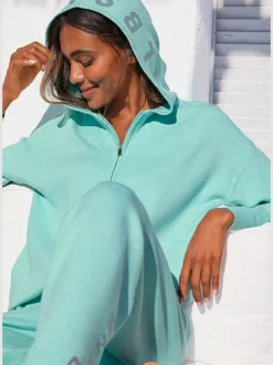Veste en tricot doux à manches longues avec capuche