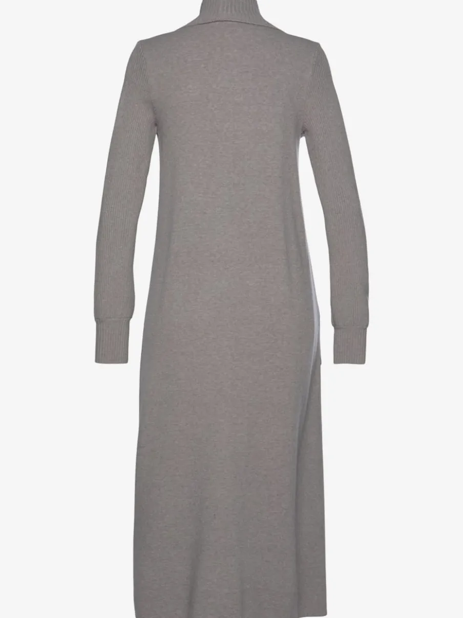 Veste en tricot long avec col châle et poches ouvertes