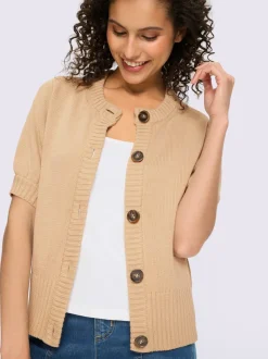 Veste en tricot manches ballon avec patte de boutonnage et encolure ronde