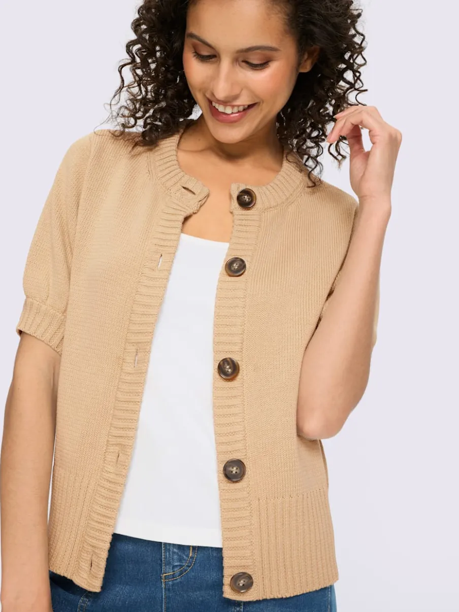 Veste en tricot manches ballon avec patte de boutonnage et encolure ronde