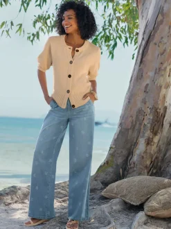 Veste en tricot manches ballon avec patte de boutonnage et encolure ronde