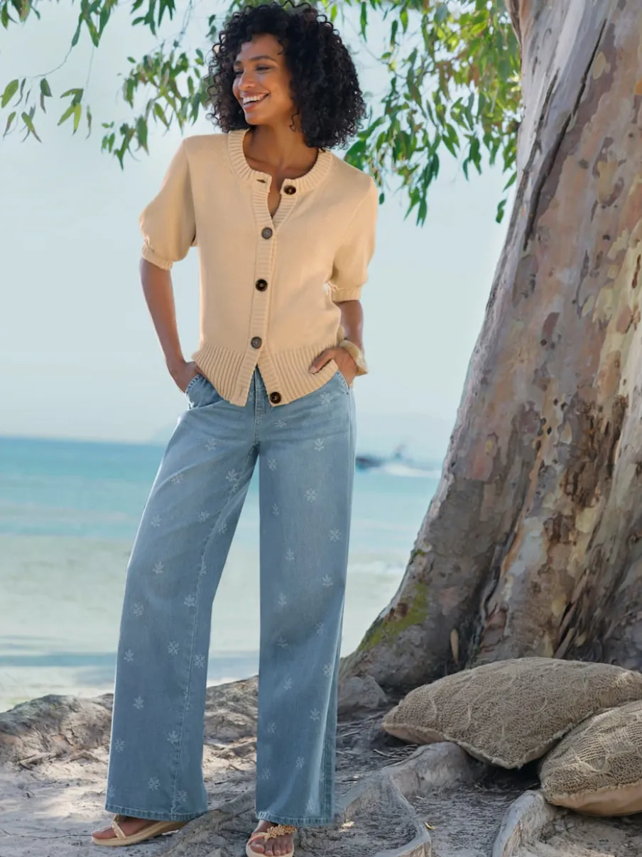 Veste en tricot manches ballon avec patte de boutonnage et encolure ronde
