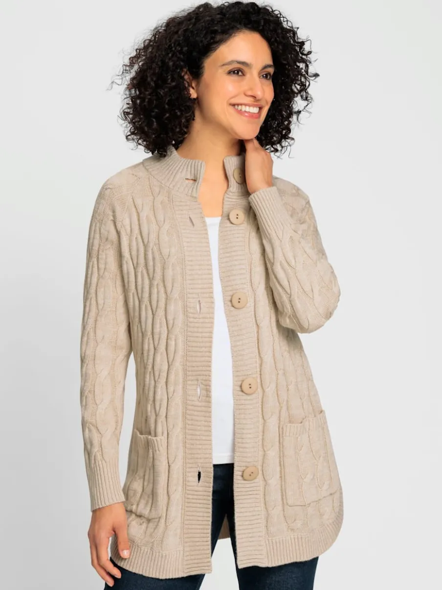 Veste en tricot torsadé avec col montant et poches