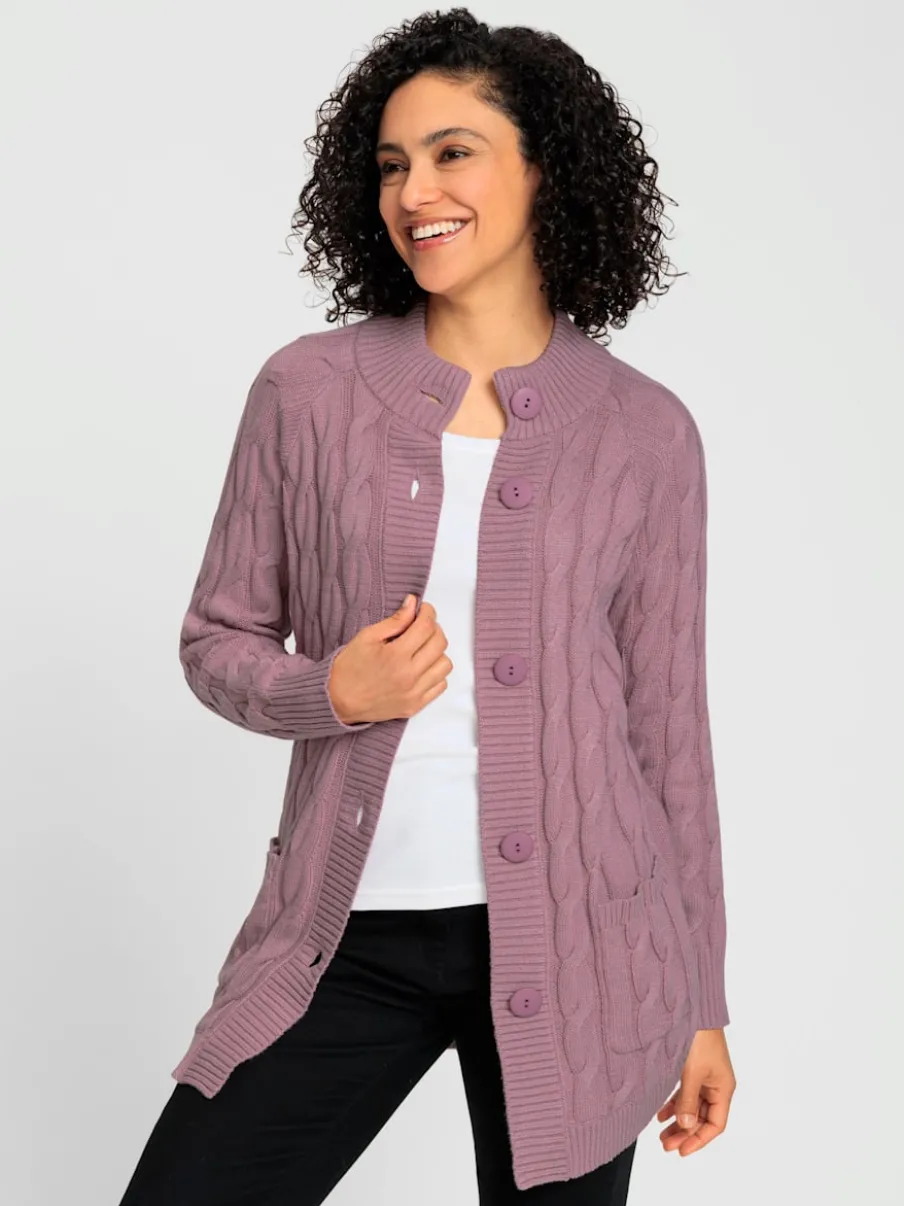 Veste en tricot torsadé avec col montant et poches