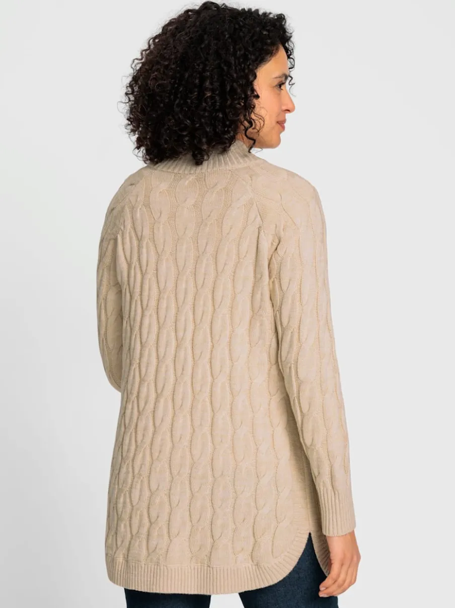 Veste en tricot torsadé avec col montant et poches