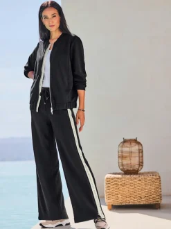 Veste légère à col montant avec glissière et bords-côtes extensibles
