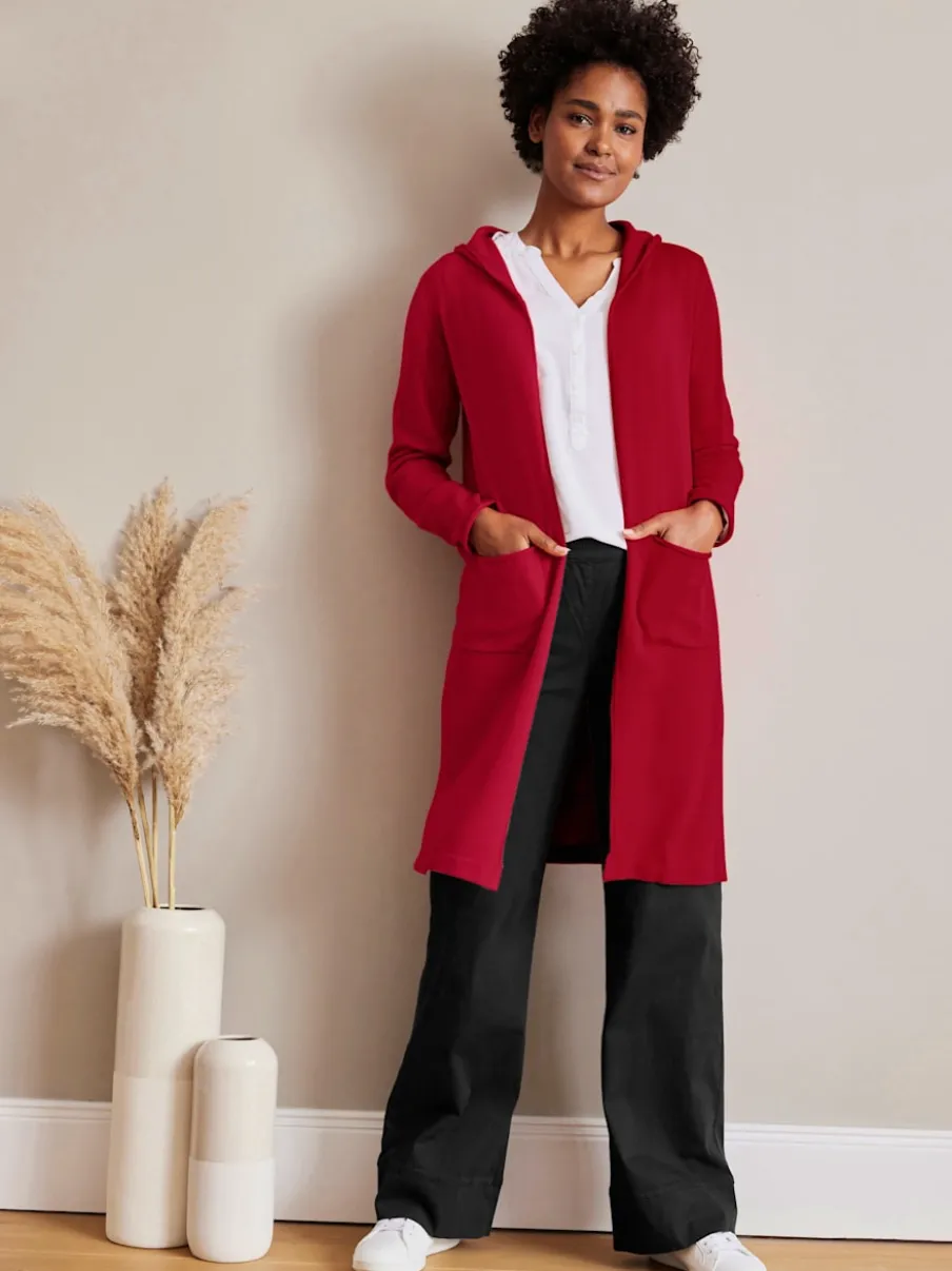 Veste longue en tricot avec capuche et fentes latérales