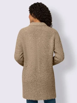 Veste longue en tricot avec col montant et poches plaquées