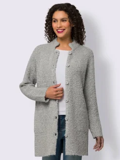 Veste longue en tricot avec col montant et poches plaquées