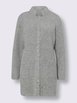 Veste longue en tricot avec col montant et poches plaquées
