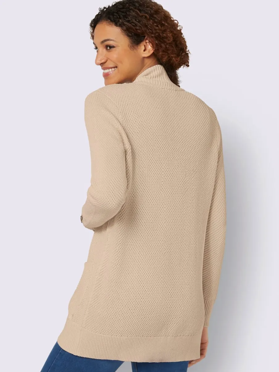 Veste longue en tricot avec poches et boutons côtelés