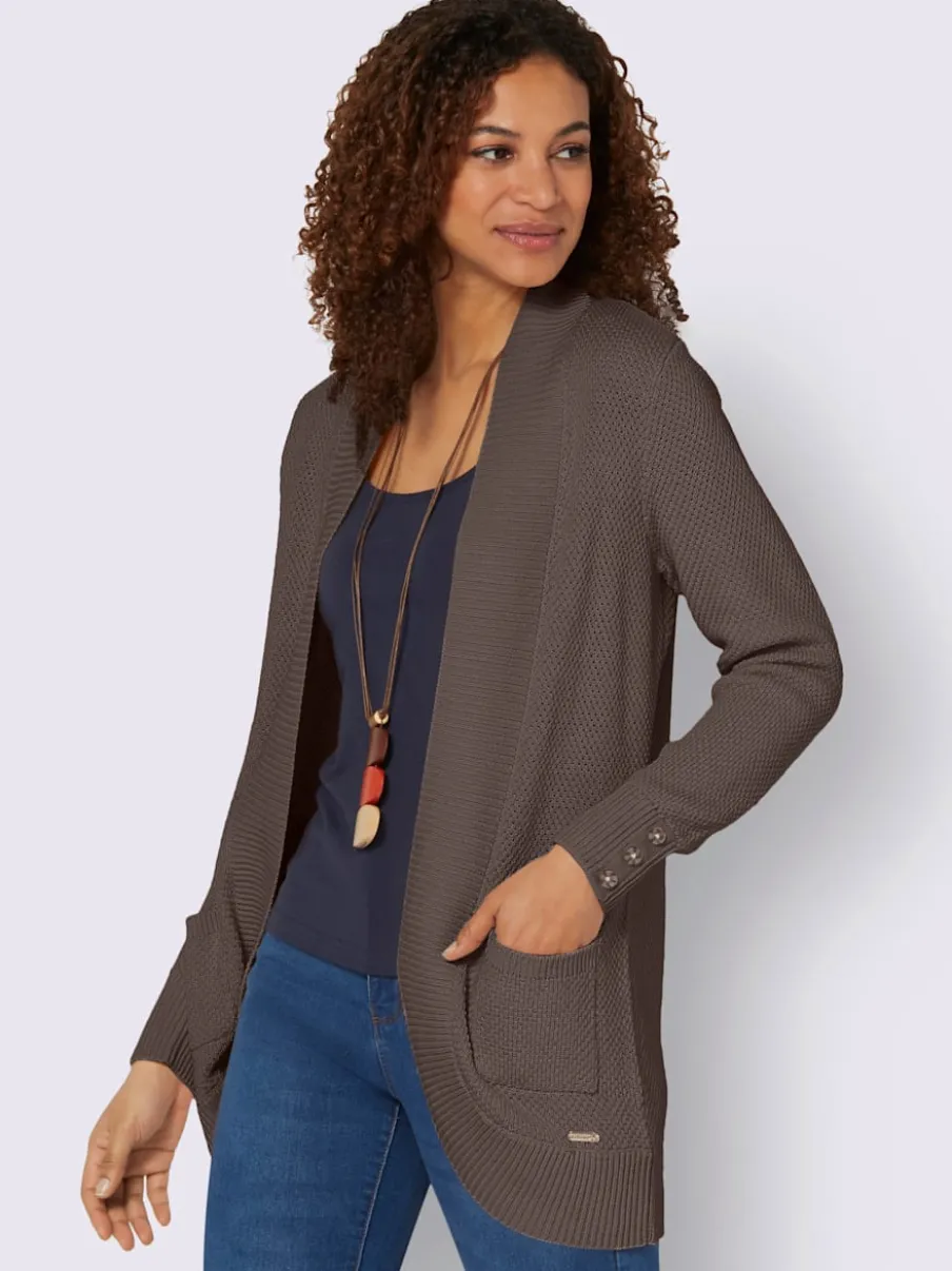 Veste longue en tricot avec poches et boutons côtelés