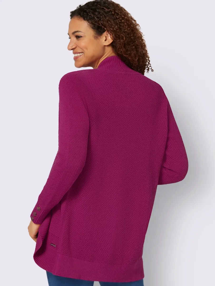 Veste longue en tricot avec poches et boutons côtelés