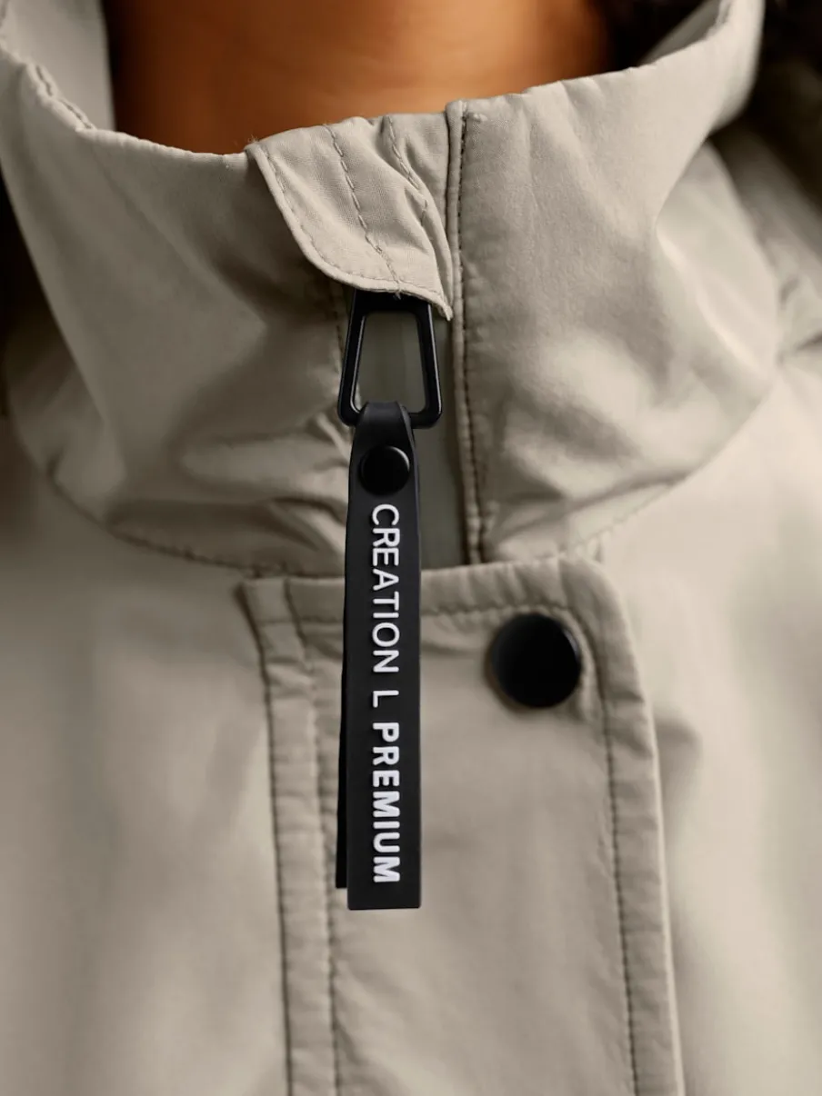 Veste technique respirante et imperméable avec capuche amovible